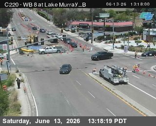 Road work with personnel and vehicles on the roadway.