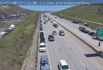 Emergency responders and vehicles on the shoulder of the highway.