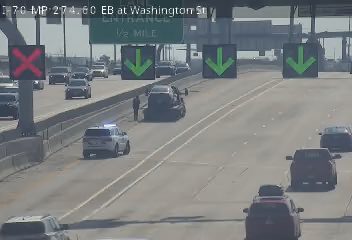 Police car with lights on the shoulder