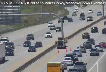 Traffic camera shows a truck and cones on the roadway, likely a responder scene.