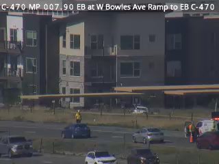 Emergency responders on scene with vehicle and cones on the roadway.