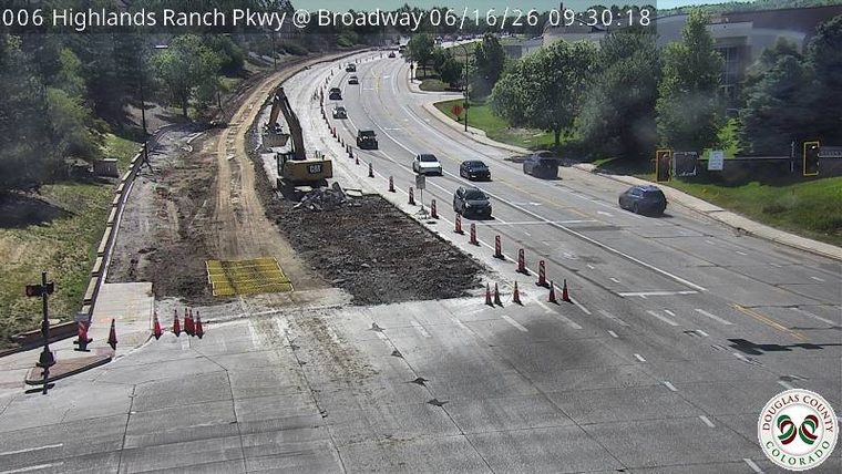 Construction zone with excavator and traffic cones, no active incident visible.