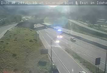 Police car with blue flashing lights on the right lane