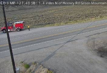 Fire truck and a person on the right shoulder