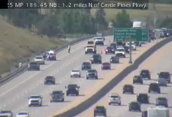 Police car with lights on the left shoulder