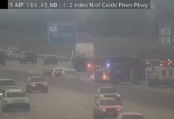 Ambulance with lights on in the right lane