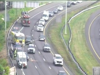 Fire truck and emergency personnel on the right shoulder