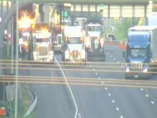 Fire on a semi-truck in the left lane