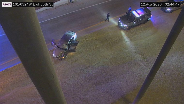 Police car with blue and red lights on the roadway