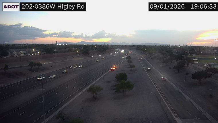 Vehicle with flashing red and blue lights on the right shoulder