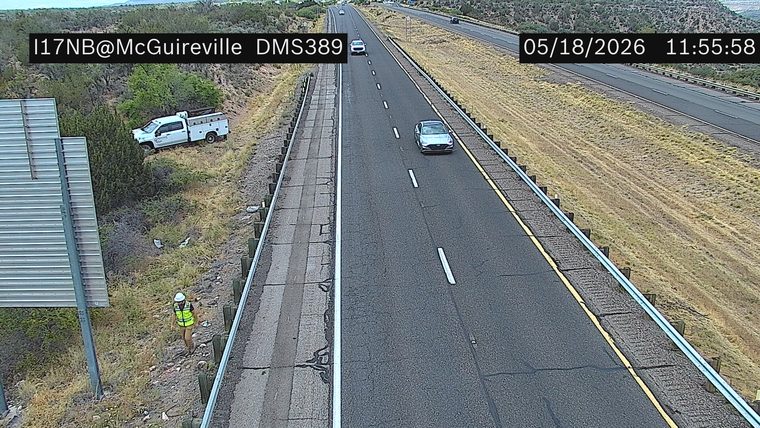 White pickup truck off the roadway on the left side