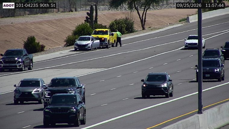 Tow truck and car on the right shoulder
