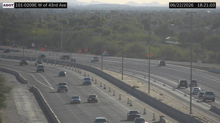 Construction cones and orange signs in the right lanes
