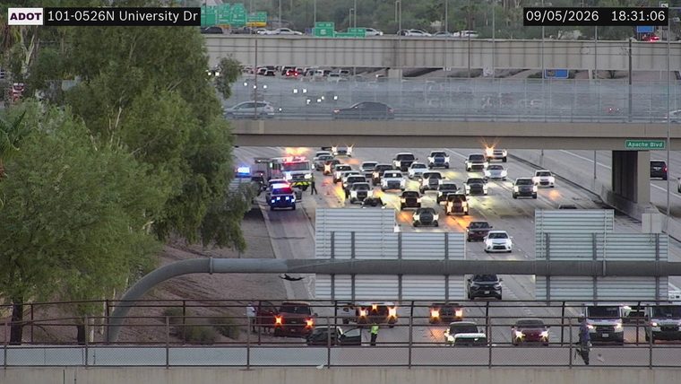 Multiple emergency vehicles and personnel on the roadway