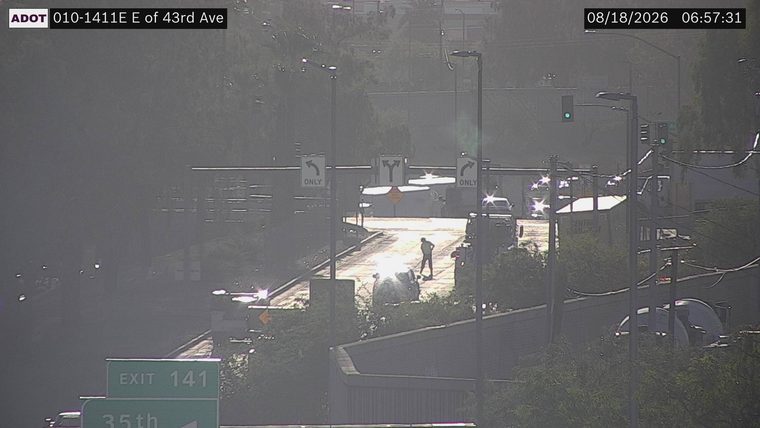 Person standing in the roadway
