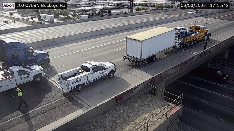 ADOT Incident Response Unit truck and tow truck with a semi-trailer in the right lane
