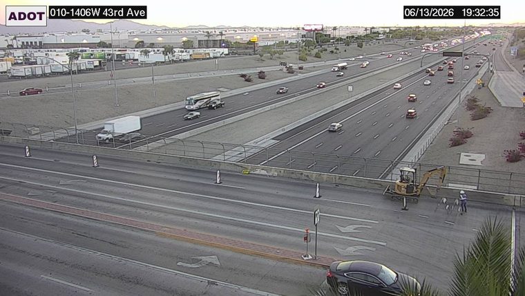 Construction cones and a person in the right lane