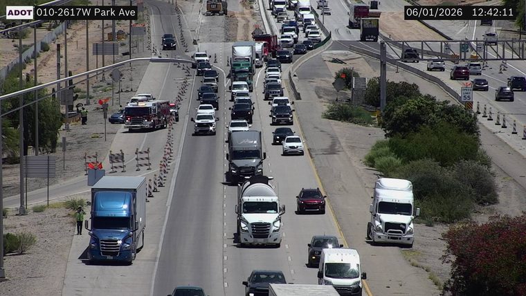 Fire truck and two workers on the left shoulder