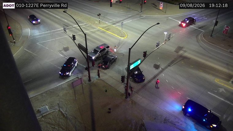 Police car with red and blue lights on the roadway