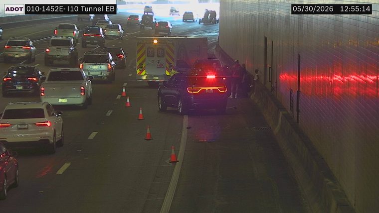 Fire truck and ambulance with emergency lights on in the right lane