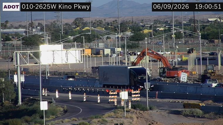Construction zone with excavator and barriers