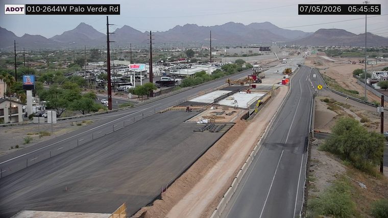 Construction activity with workers and equipment in the right lanes