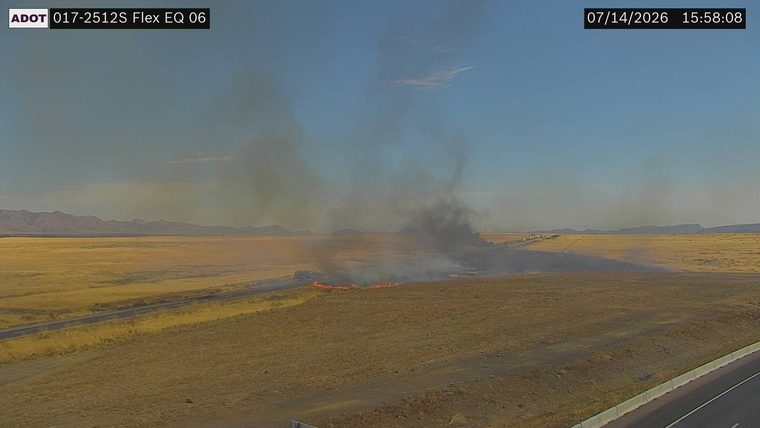 Fire and smoke on the right side of the roadway