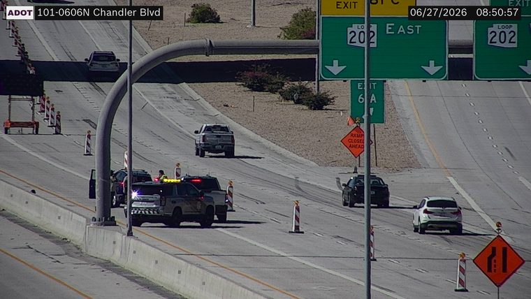 Police car with lights on the shoulder