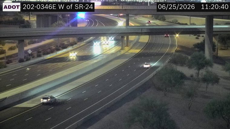 Police car with blue and red lights on the overpass
