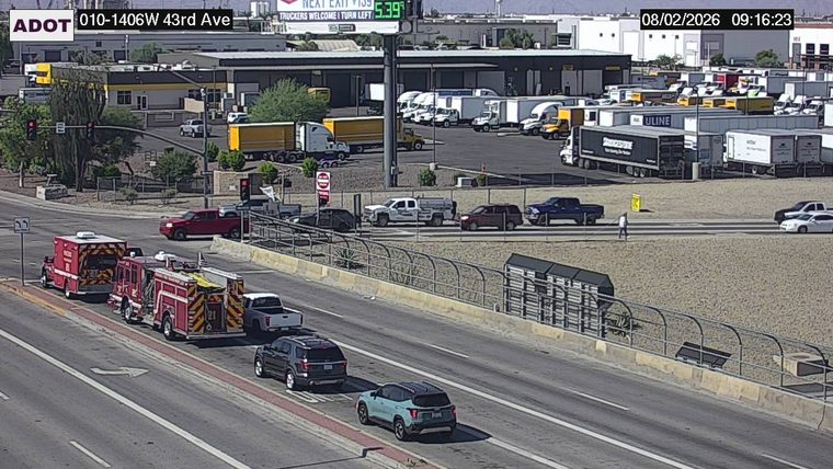 Two fire department vehicles on the right shoulder