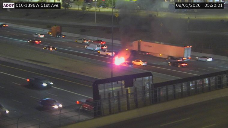 Vehicle on fire in the right lane