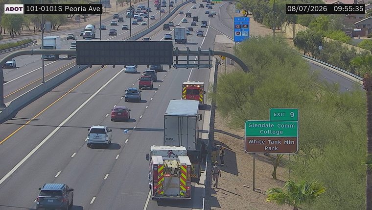 Fire truck and ambulance with personnel on the right shoulder