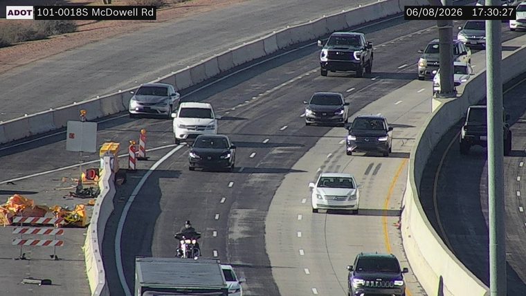 Construction cones and barriers in the left lane