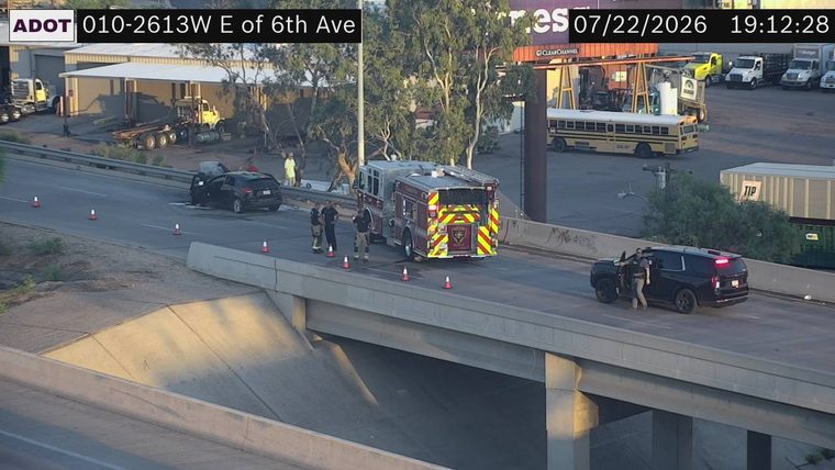Fire truck and police SUV with officers present on the roadway