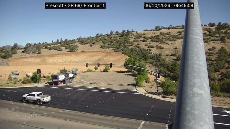 Construction equipment and cones in the roadway