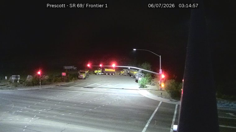 Construction vehicles and traffic lights in the intersection