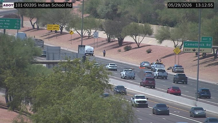 Tow truck and police car on the right shoulder