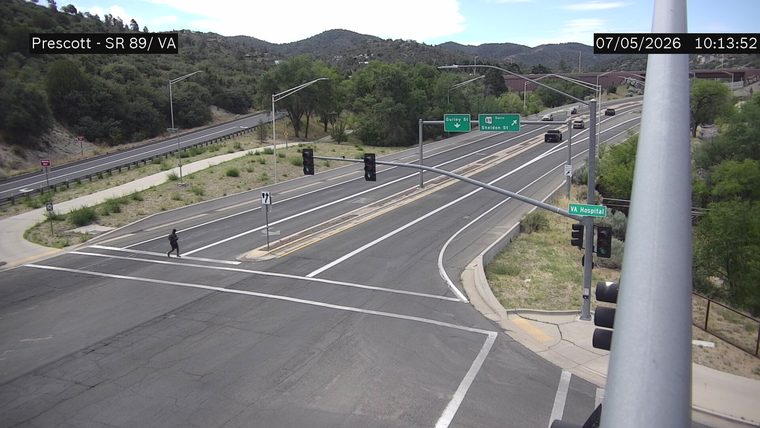Person crossing the street at the intersection
