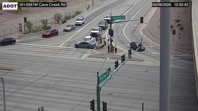 Two vehicles collided in the intersection, with one vehicle appearing to have damage to its front end and the other to its side.