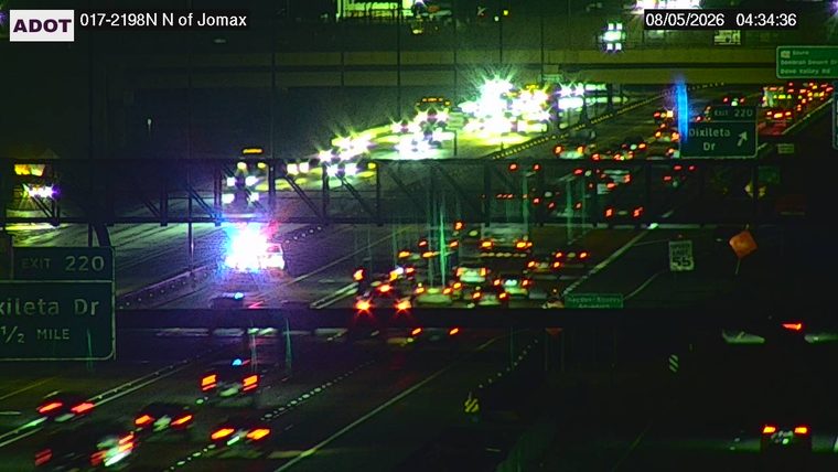 Police car with red and blue lights on the roadway