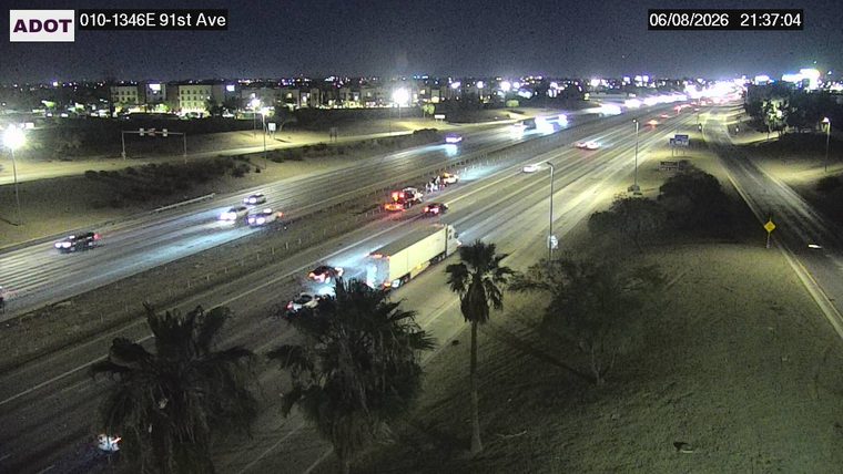 Multiple vehicles and emergency responders in the left lanes