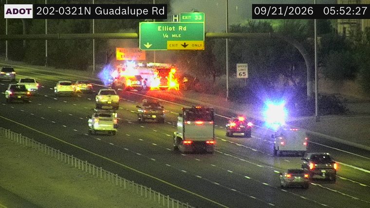 Fire truck with flames and emergency lights in the right lanes