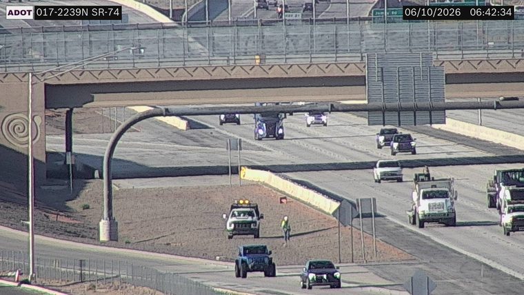 Worker and vehicle on the shoulder