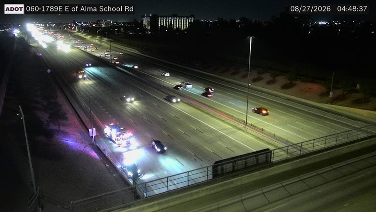Fire truck with red and blue lights on the left shoulder