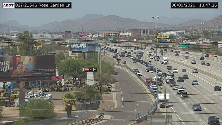 Fire truck and other vehicles stopped on the left shoulder