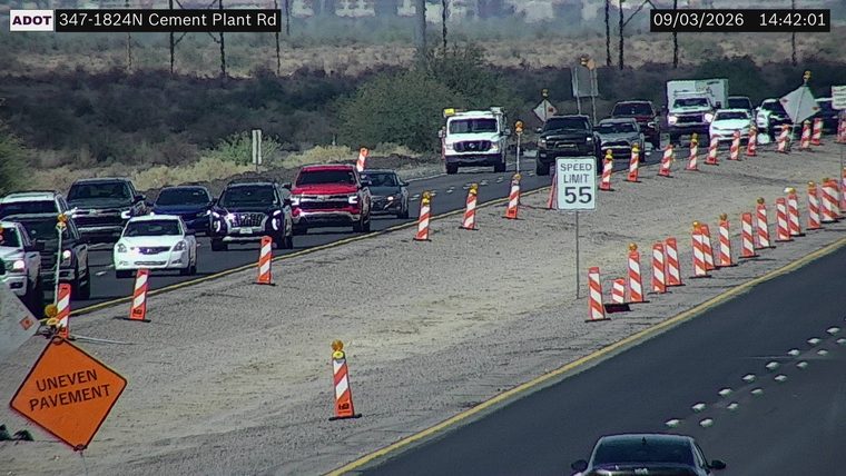 Construction cones and uneven pavement sign in the right lane