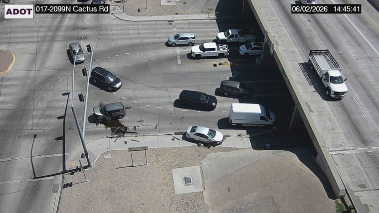 Fire truck and two damaged vehicles in the intersection with responders present
