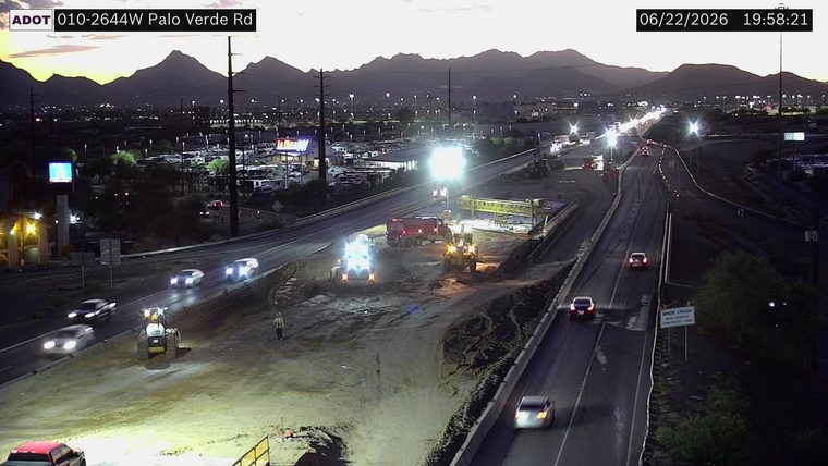Construction equipment and workers in the roadway