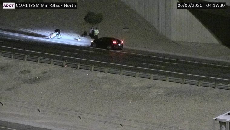 Multiple emergency vehicles and personnel on the roadway
