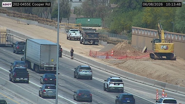 Construction equipment and barriers on the right side of the roadway